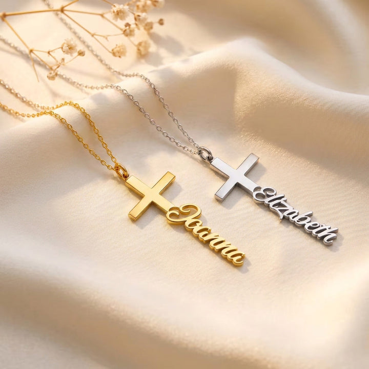Gold and silver personalised cross necklaces with the names Joanna and Elizabeth in script