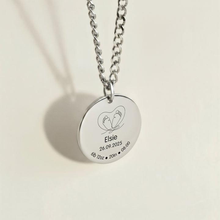 Silver necklace with a heart-shaped baby feet engraved pendant with &