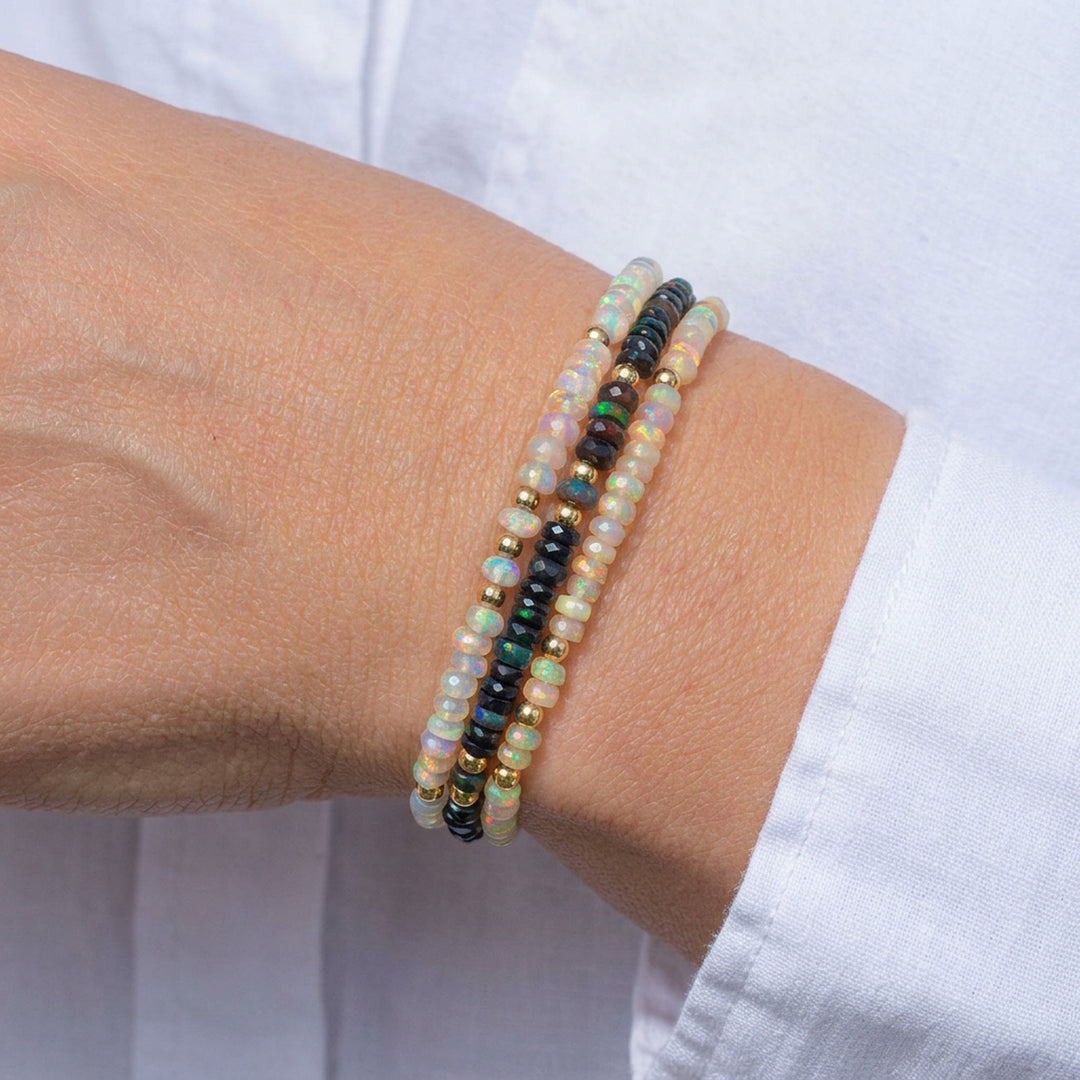 Three Abiza opal bracelets — black, white and natural opal Fine range