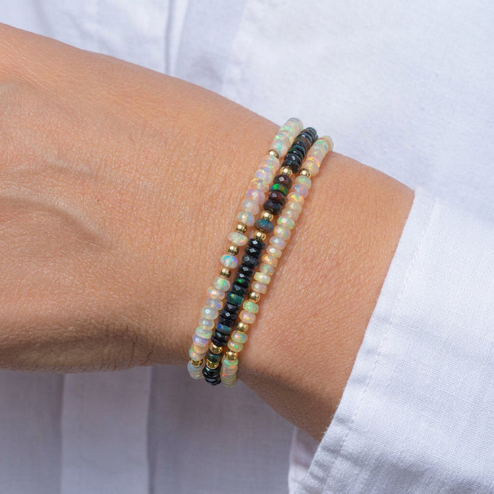 Three Abiza opal bracelets — black, white and natural opal Fine range