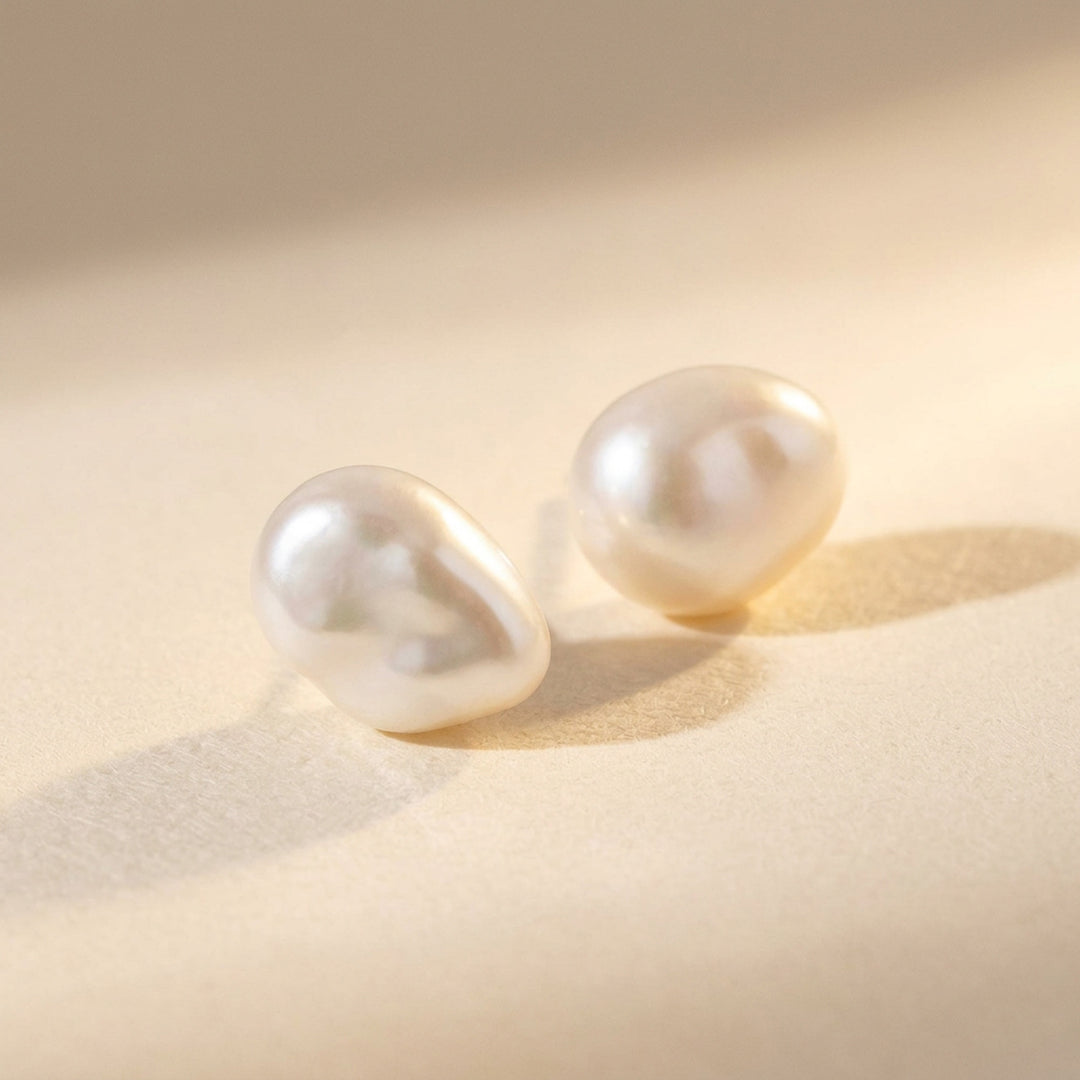 Real keshi freshwater pearl stud earrings — each pearl uniquely shaped, sterling silver posts and butterfly backs