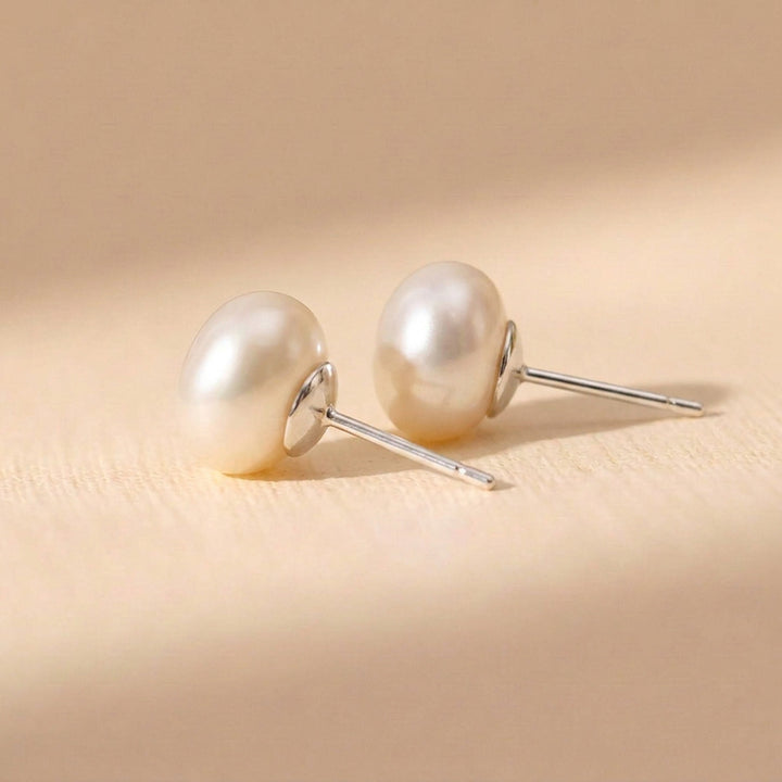 Real keshi freshwater pearl stud earrings — each pearl uniquely shaped, sterling silver posts and butterfly backs