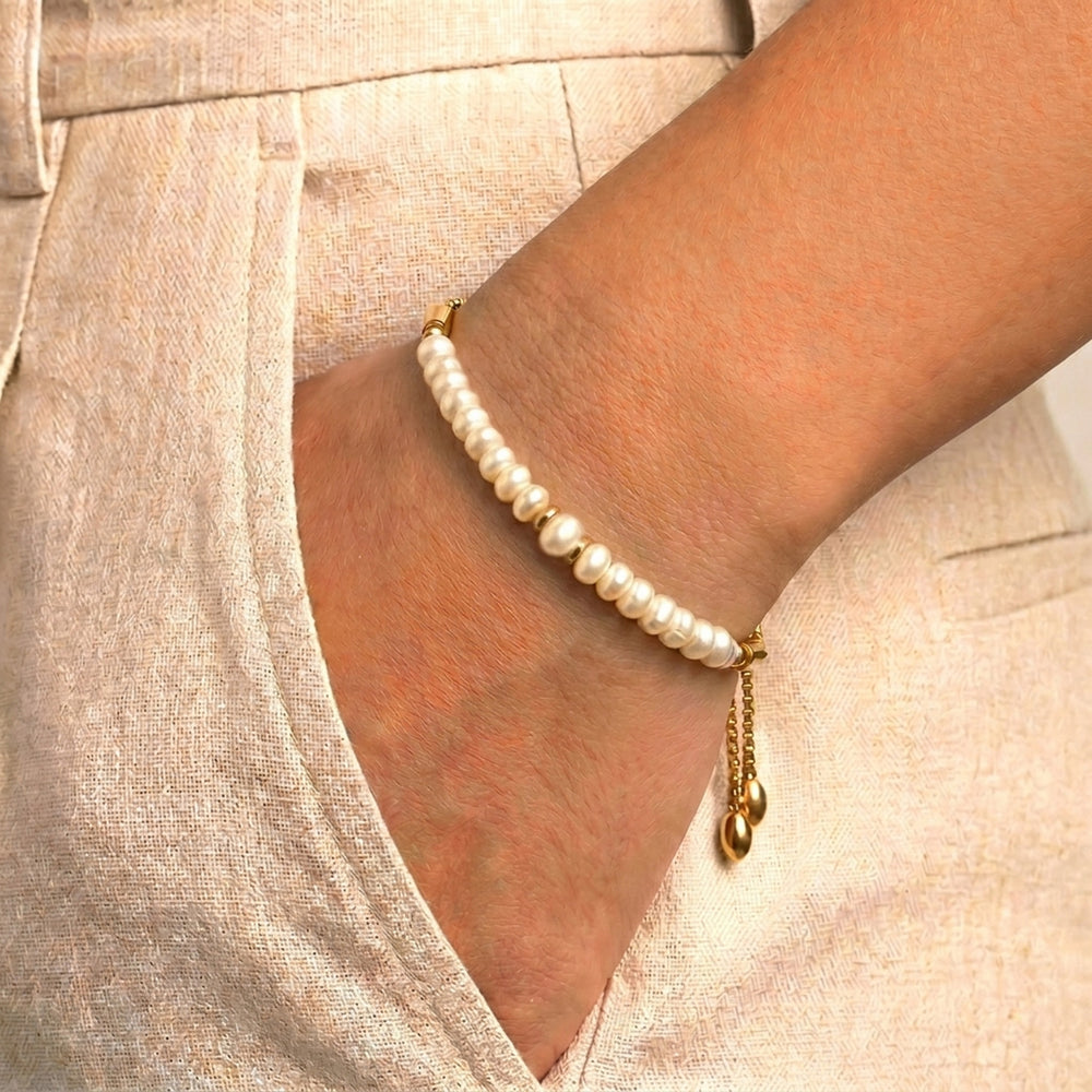 Model wearing Abiza June birthstone pearl bracelet on wrist