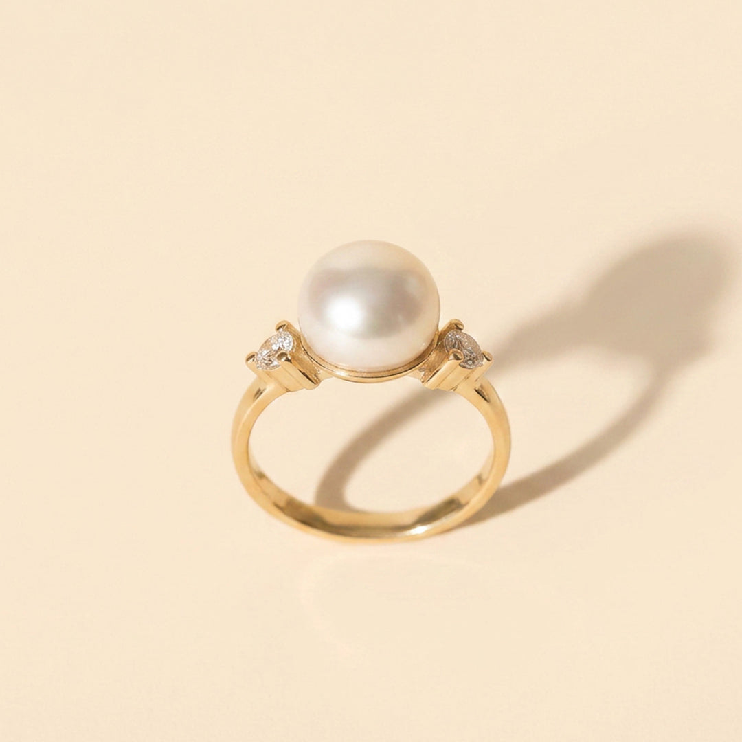 Gold vermeil pearl ring showing the 8mm freshwater pearl and 2.5mm white topaz side stones