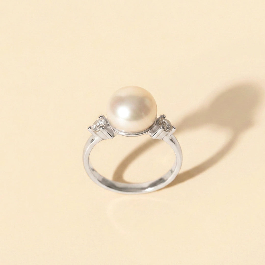 Sterling silver pearl ring with two white topaz accents — June birthstone ring
