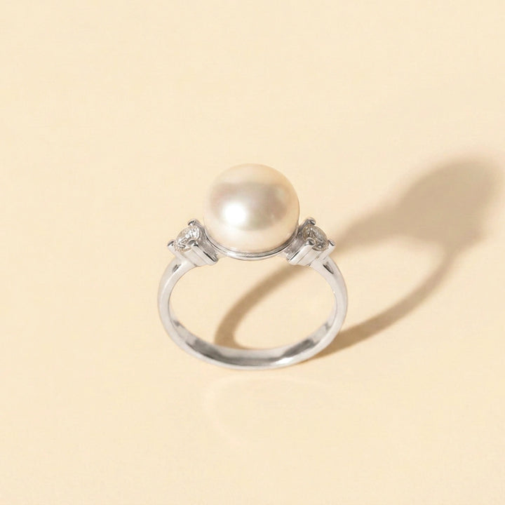 Sterling silver pearl ring with two white topaz accents — June birthstone ring