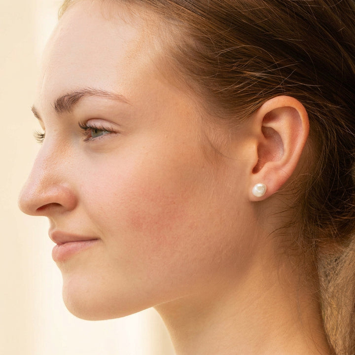 Real freshwater pearl stud earrings on a young woman