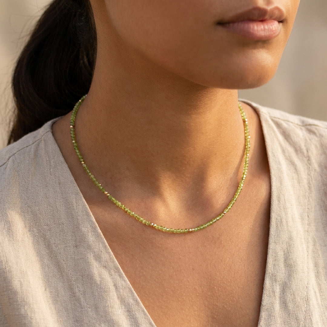 Real peridot necklace on model — hand-strung in our Chester studio, August birthstone