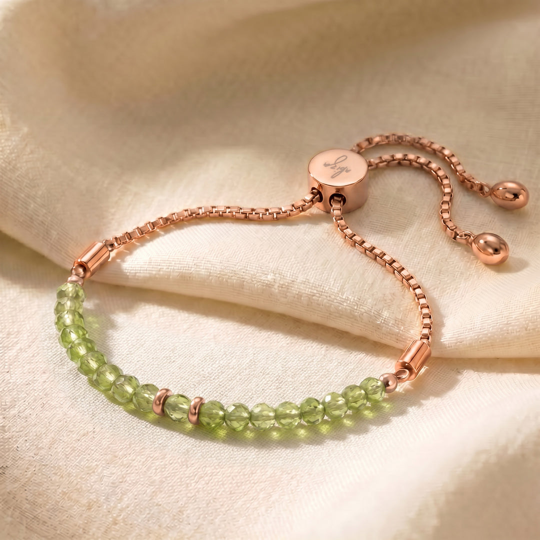 Rose gold August birthstone peridot bracelet with genuine peridot beads, adjustable slider chain