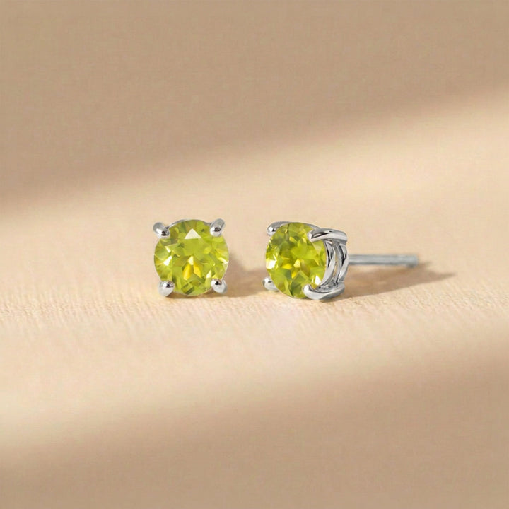 Real 4mm peridot stud earrings on sterling silver posts and butterfly backs