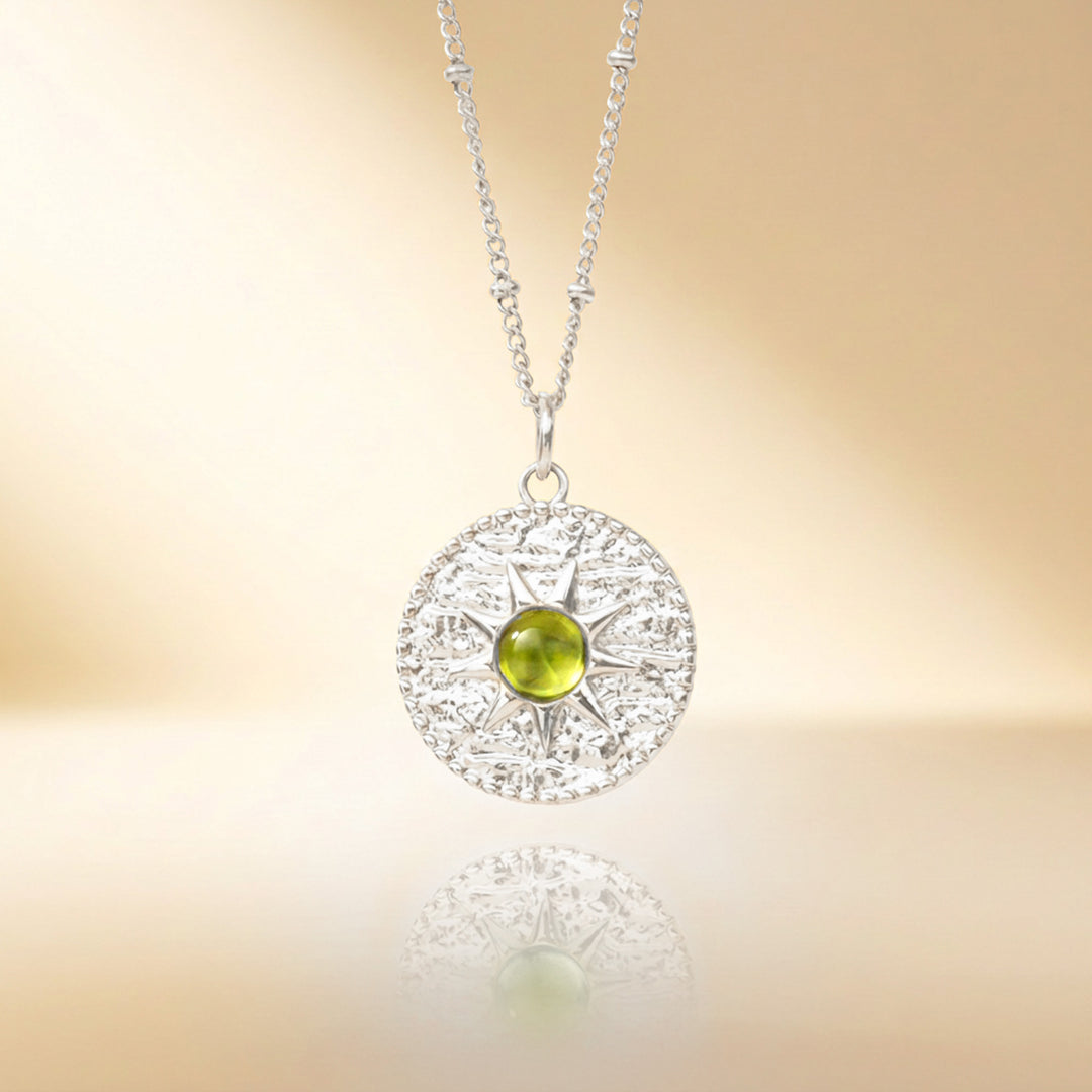 Silver peridot sun necklace — real peridot, handmade UK