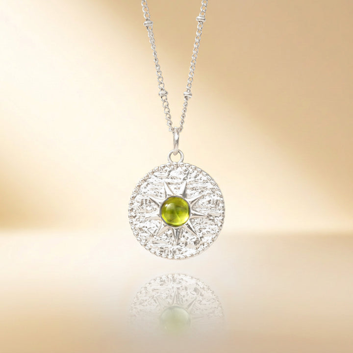 Silver peridot sun necklace — real peridot, handmade UK
