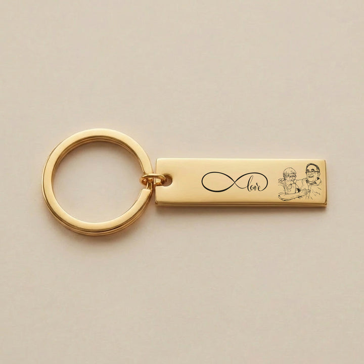 gold photo keyring with infinity love engraving and custom couple illustration