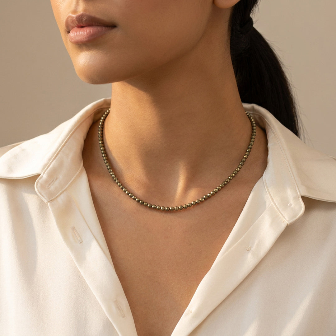Pyrite necklace on model — three lengths available, choker to 18-inch