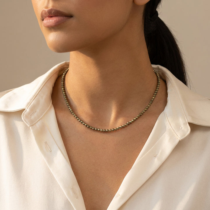Pyrite necklace on model — three lengths available, choker to 18-inch