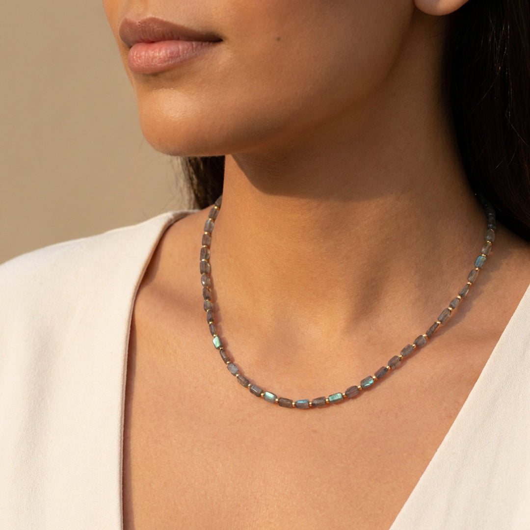 Real labradorite necklace on model — hand-cut rectangle beads, iridescent blue-gold flash, hand-strung in Chester