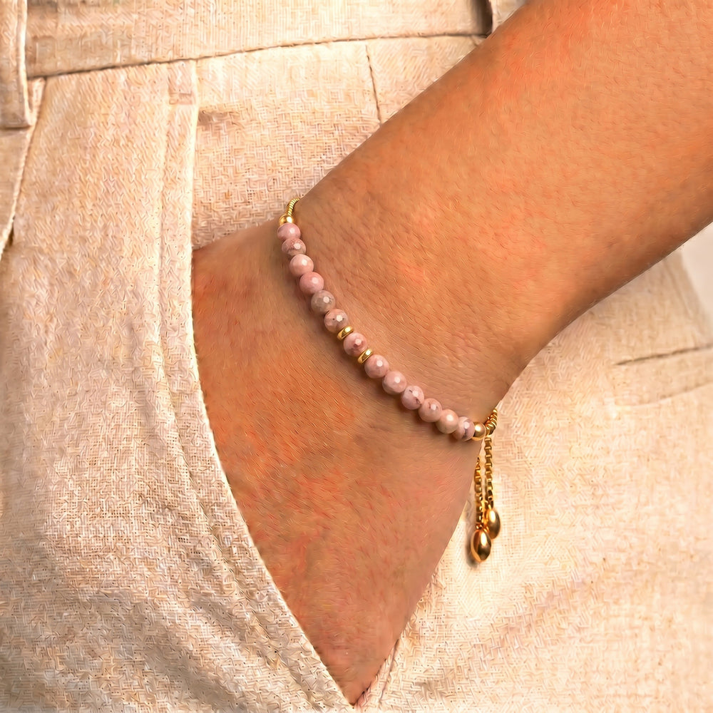 Model wearing Abiza rhodonite bracelet on wrist