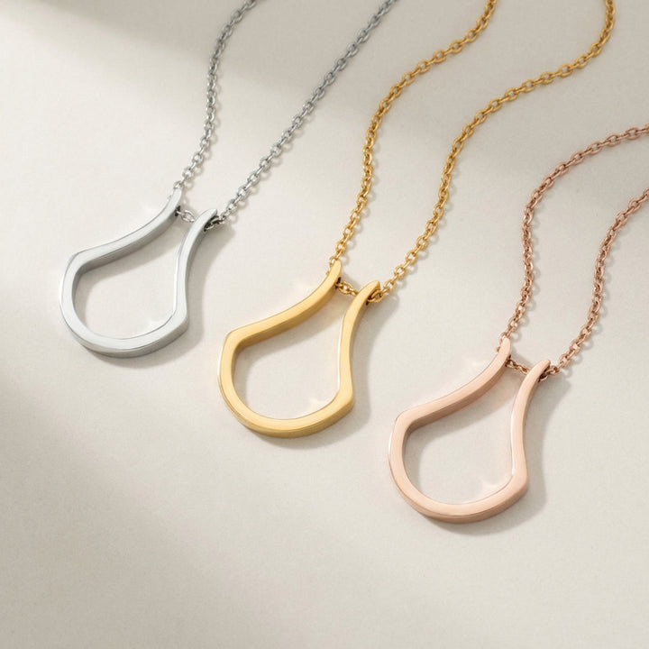 Gold, rose gold and silver ring holder necklaces side by side