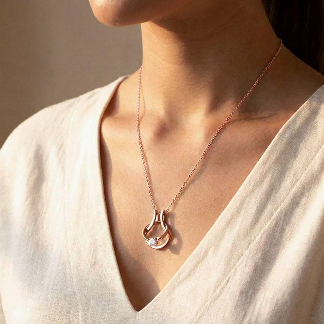 Rose gold ring holder necklace shown on neckline