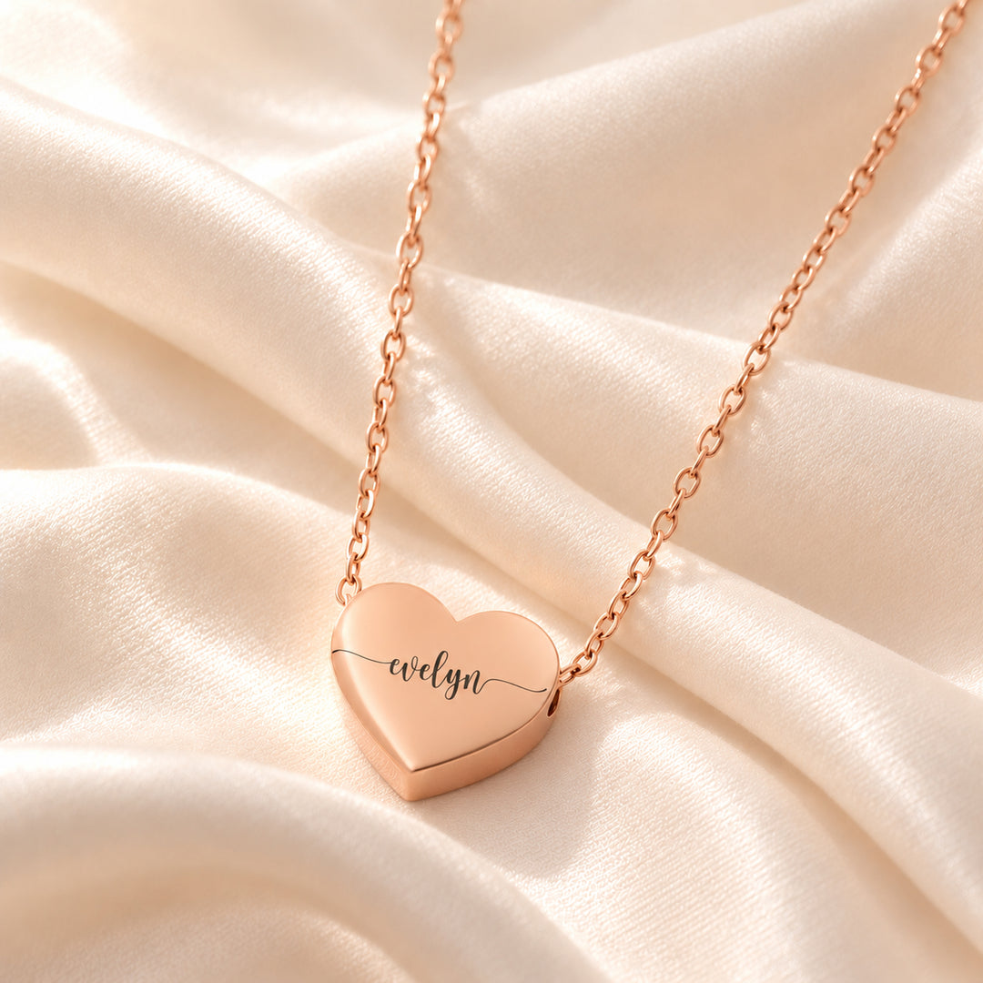 Rose gold heart name necklace engraved with the name Evelyn