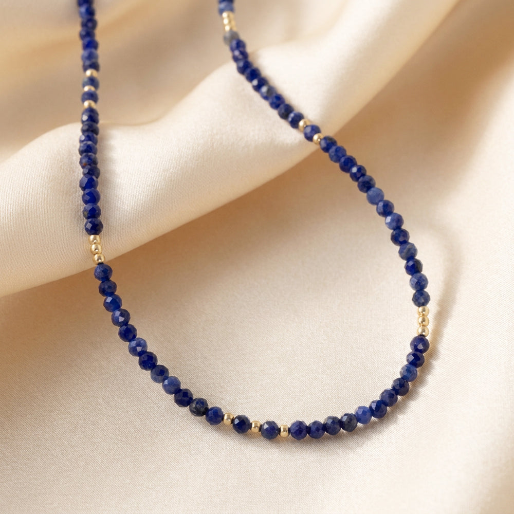 14K gold filled sodalite necklace close-up — 3mm diamond-cut deep blue beads with soft white calcite marbling