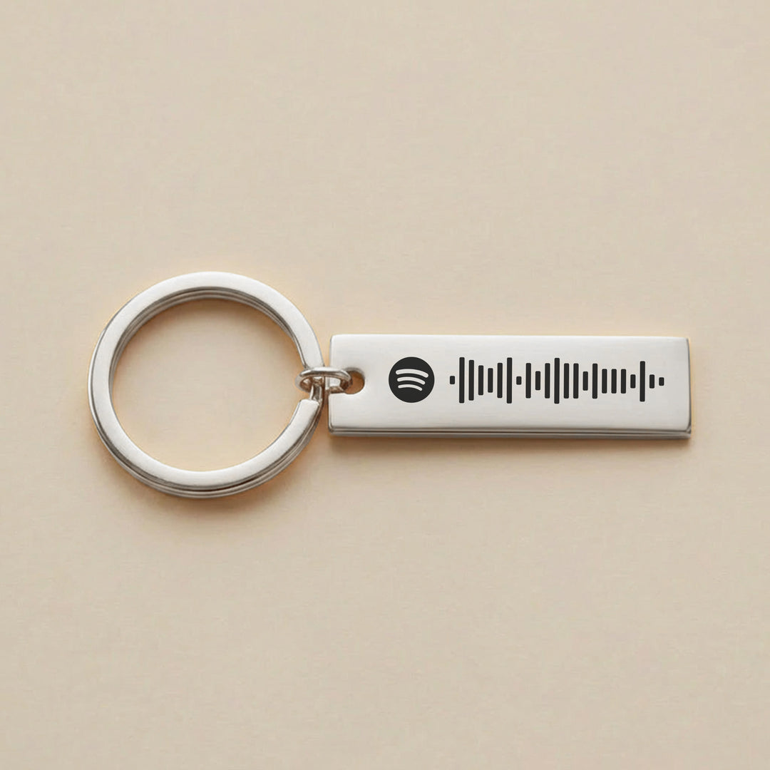 silver personalised Spotify keyring with engraved Spotify song code
