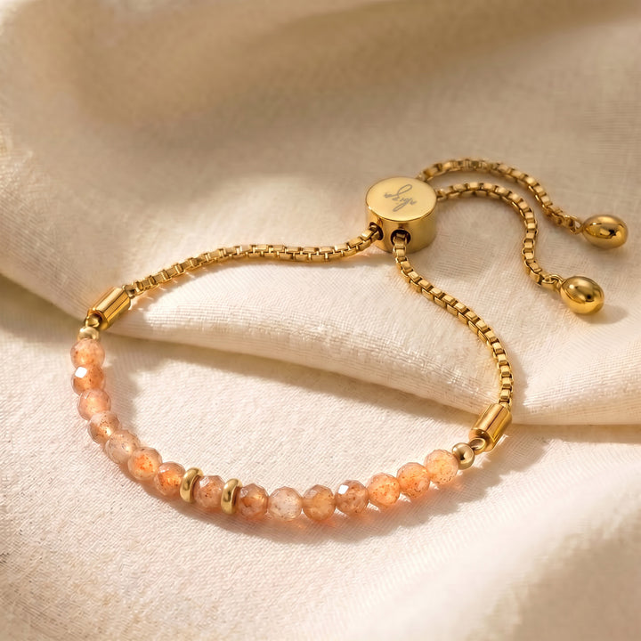 Gold sunstone bracelet with 4mm genuine warm-orange sunstone beads on adjustable slider chain