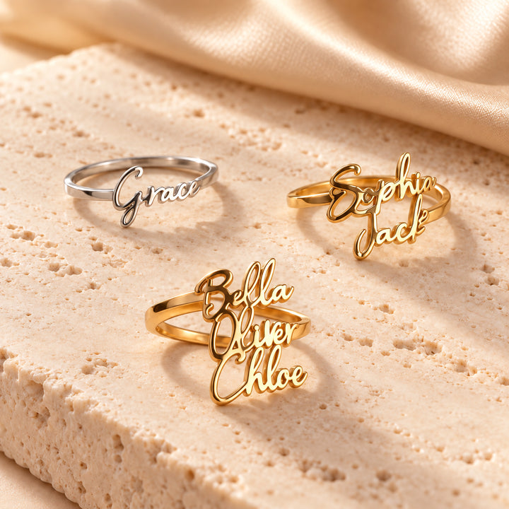 Three personalised name rings in gold and silver, showing one, two and three name options