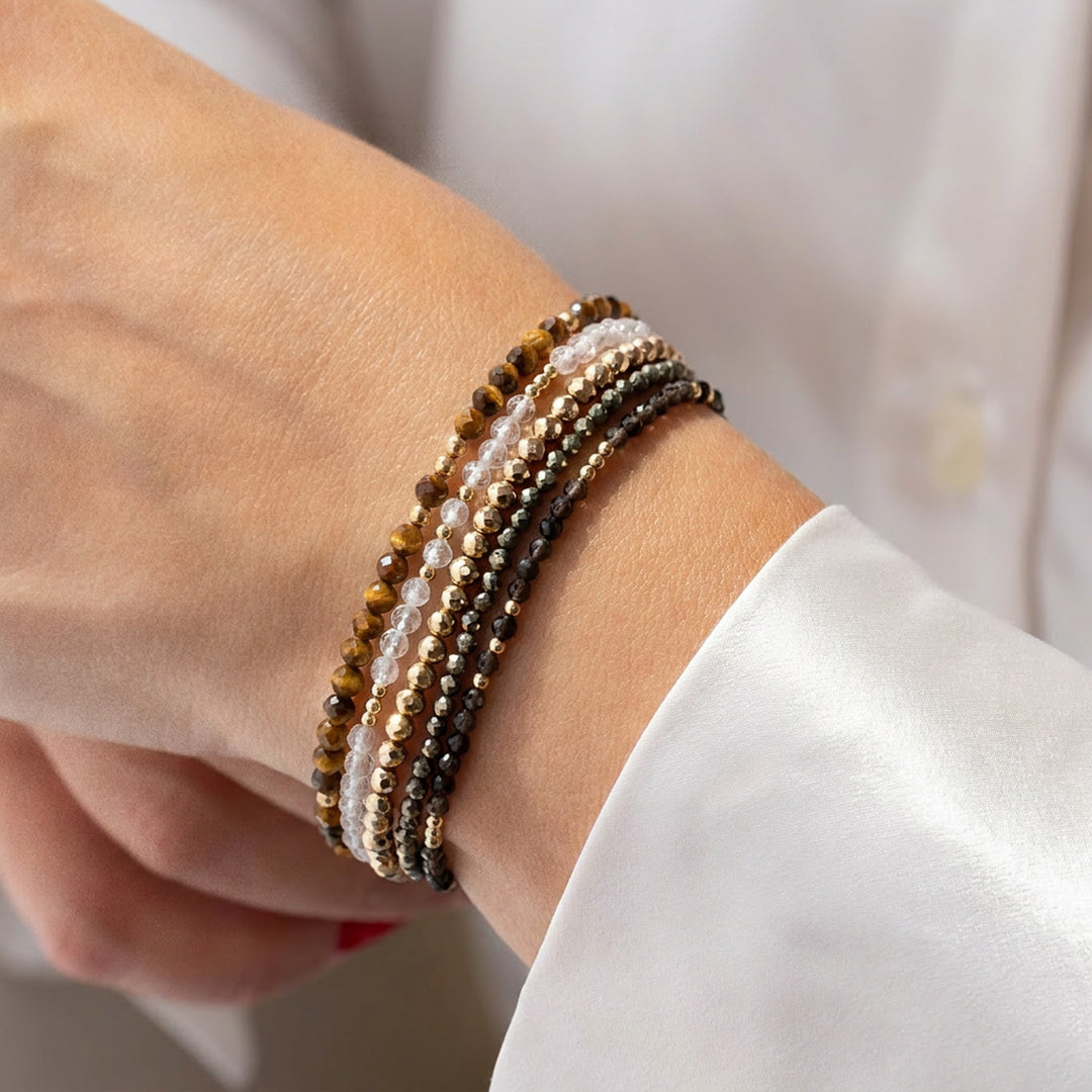 14K gold filled tiger eye bracelet stacked with other Abiza Skinny bracelets