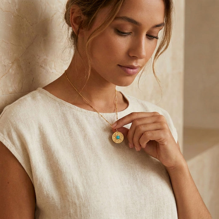 Gold turquoise sun necklace worn on chain — December birthstone gift