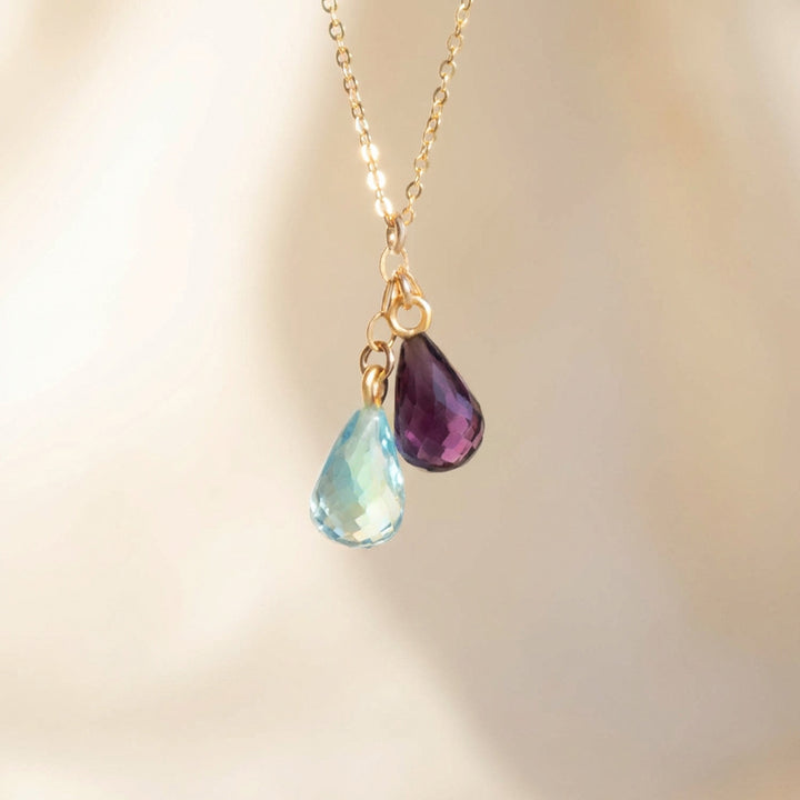 Two-stone family birthstone necklace, dainty teardrop crystals close-up