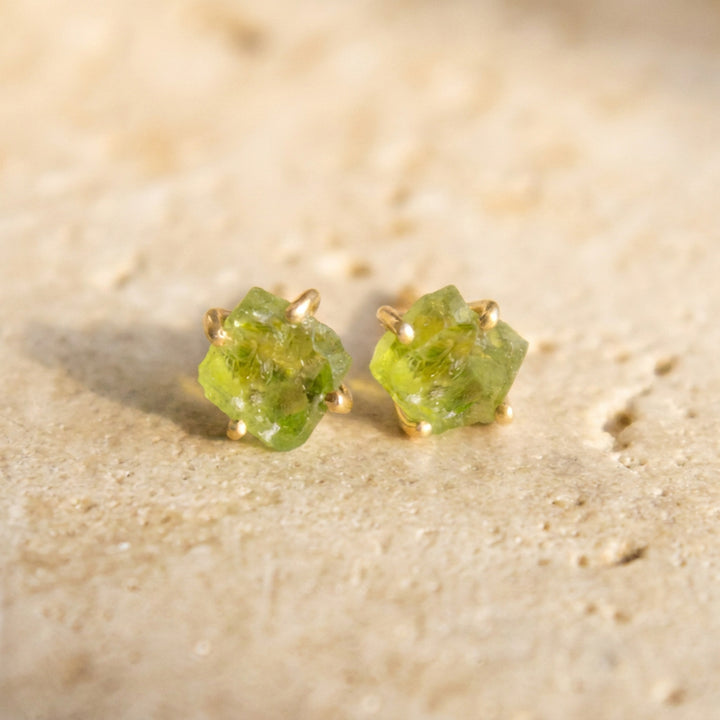 Raw peridot stud earrings in 18K gold vermeil — hand-set uncut peridot on ear posts and butterfly backs