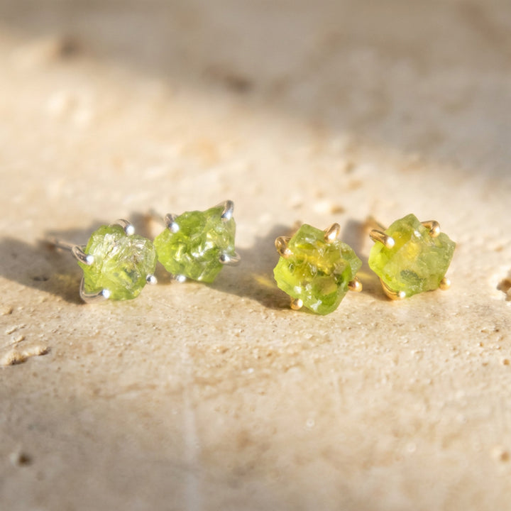 Real raw peridot stud earrings — silver and gold pair together, hand-matched natural crystals
